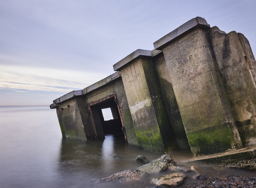 WWII Reinforced concrete sea defence building defeated by coastal erosion.