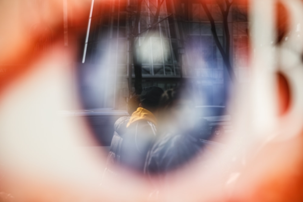reflexion of an eye poster in the window 